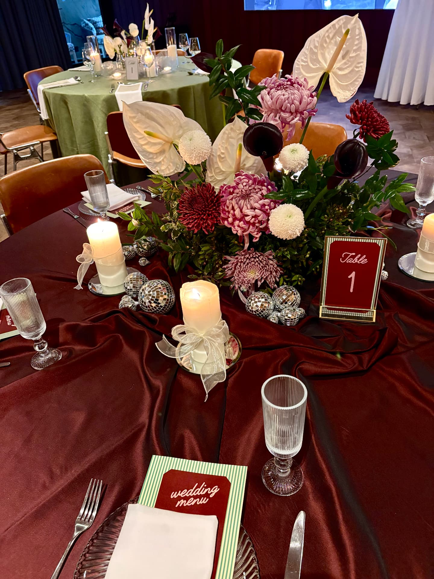 Burgundy satin tablescape with florals and Table 1 stationery