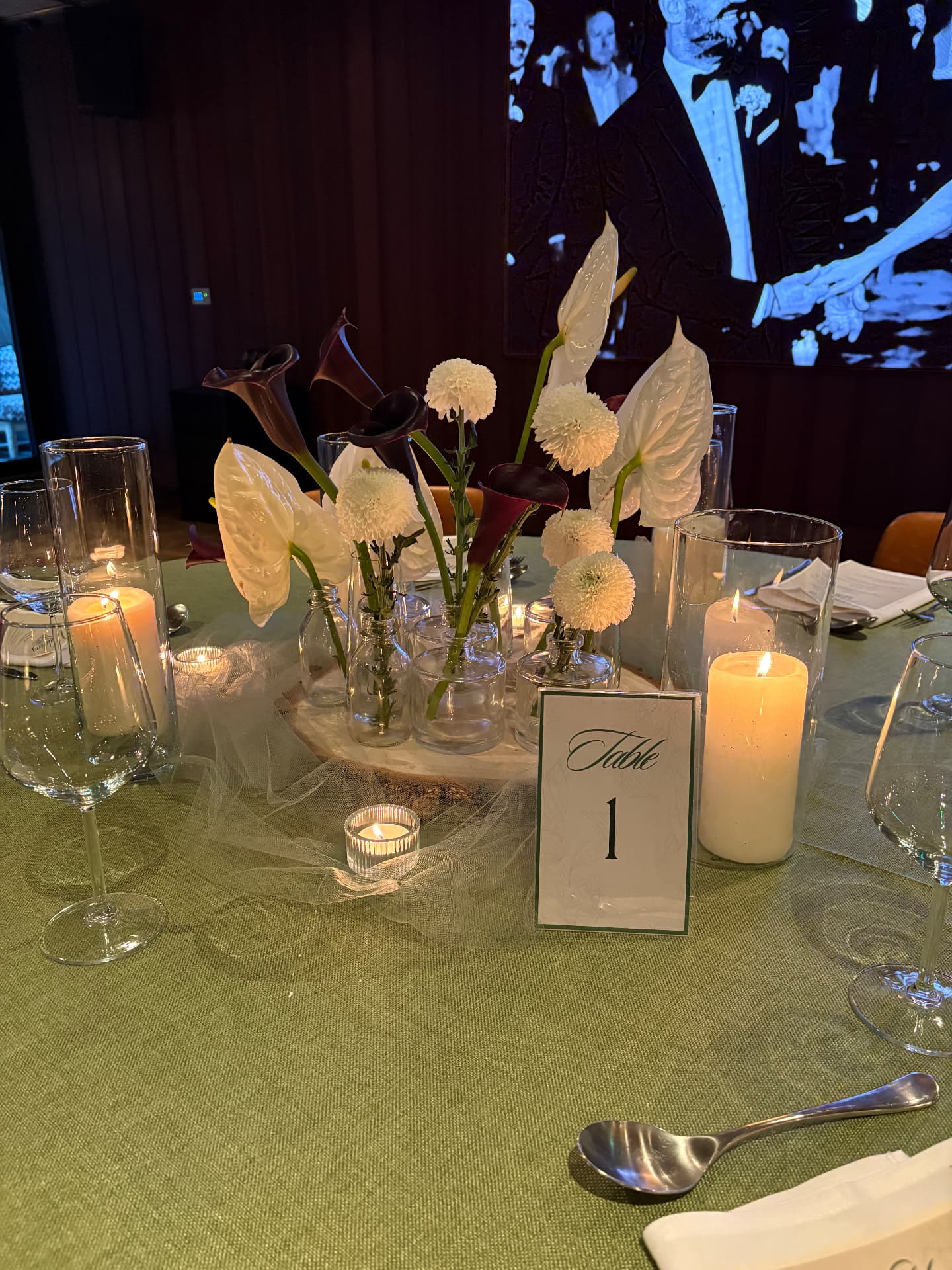 Sage tablescape with calla lilies, anthuriums, bud vases and candles